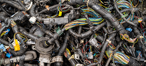 Image of a pile of used wires from cars