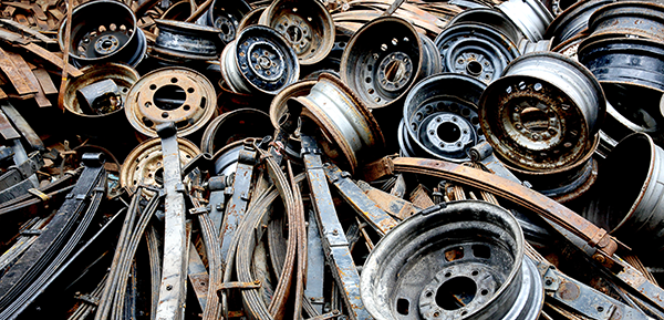 Pile of scrap metal of wheel and car parts